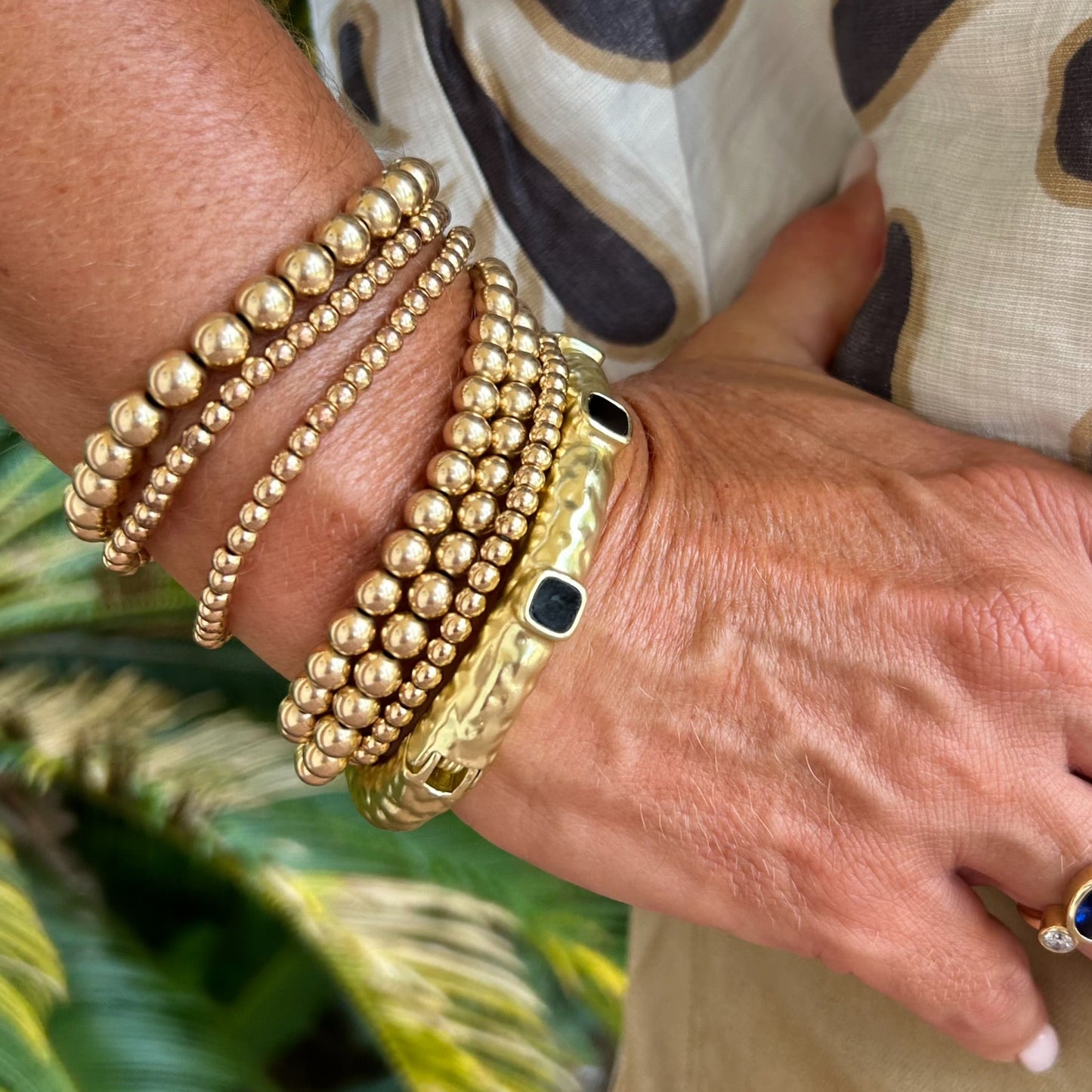 Gold Bangle with 3 Black Stones