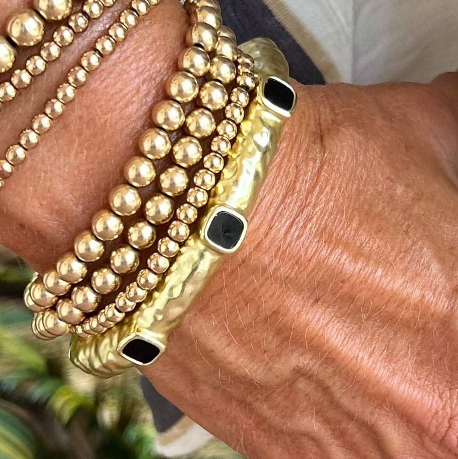 Gold Bangle with 3 Black Stones