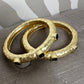 Gold Bangle with 3 Black Stones